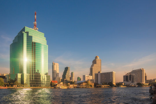 Bangkok Skyline as Seen from the Eastern Chao Phraya River Embankment at Sunset