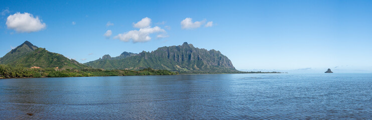 Fototapeta na wymiar Panorama of Chinaman's hat off the coastline of Oahu in Hawaii from the Waiahole Beach Park
