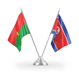 North Korea and Burkina Faso table flags isolated on white 3D rendering