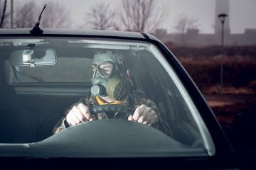 soldier driving a car with gas mask