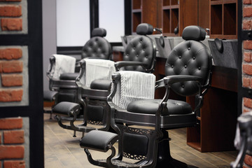 Interior of barbershop.Classic style.Stylish vintage barber chair. Barbershop theme.