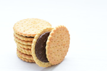  Chocolate cookies displayed on light background