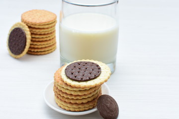 Fototapeta na wymiar Chocolate cookies accompanied by glass of milk
