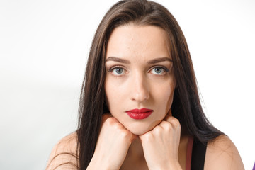 Business young beautiful lady on a white background shows different emotions copy space