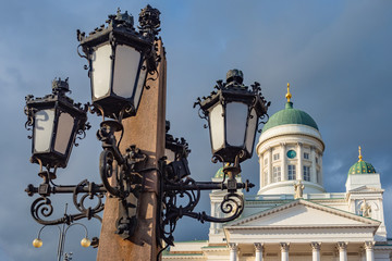 Fototapeta na wymiar Helsinki. Finland St. Nicholas Cathedral. Lantern on the background of the Suurkirkko temple. Orthodox Church in Helsinki. Architecture of Finnish cities. Traveling in Finland. European Union