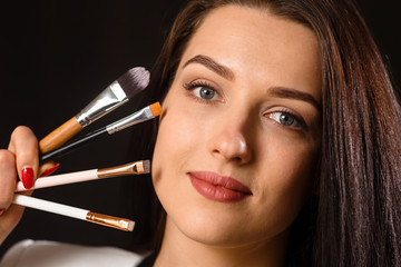 Obraz premium Business young beautiful lady with tweezers and bones for makeup