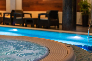 Modern blue on light backdrop. Water - swimming pool. Blue luxurious swimming pool. Swimming pool for luxury lifestyle design. Water - swimming pool. Luxury lifestyle. Natural pattern, luxury. Blue