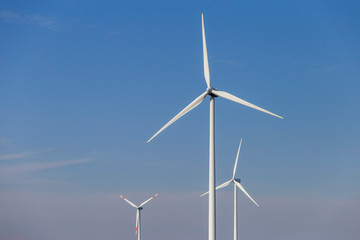 Fototapeta premium Wind turbine spinning for renewable electricity production