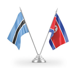 North Korea and Botswana table flags isolated on white 3D rendering