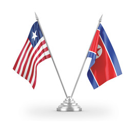 North Korea and Liberia table flags isolated on white 3D rendering