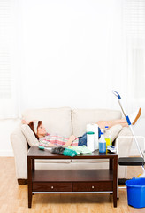 Cleaning: Tired Woman Takes a Break from Cleaning