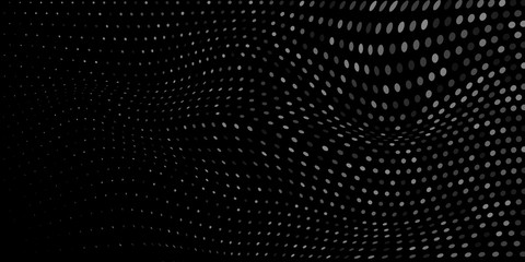 Abstract background made of halftone dots in white and black colors