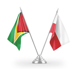 Poland and Guyana table flags isolated on white 3D rendering