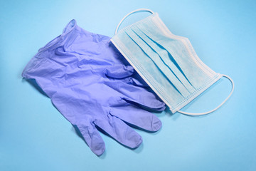 Medical gear protecting against transmittable diseases, on blue background