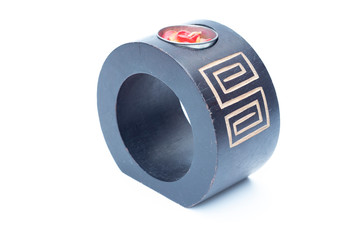 Brown wooden candlestick on a white background