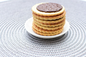 Chocolate cookies displayed on light background