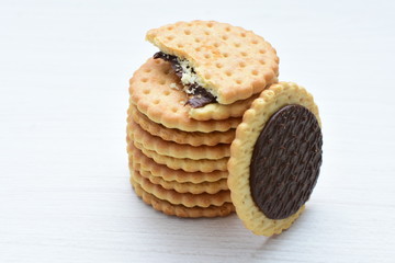Chocolate cookies displayed on light background