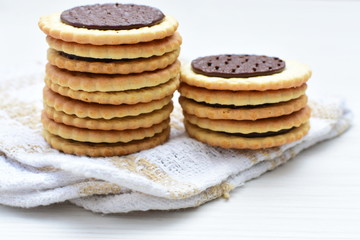 Chocolate cookies displayed on light background