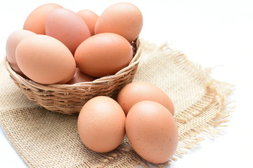 Peasant chicken eggs on light background