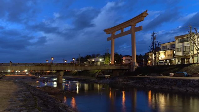 Time lapse of Japanese Torii pole at Miyamae Bridge at night in Takayama old town, Gifu, urban city in Japan. Architecture background.