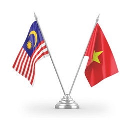 Vietnam and Malaysia table flags isolated on white 3D rendering