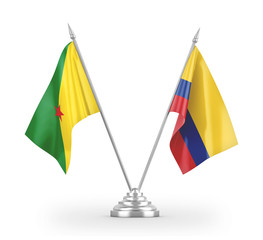 Colombia and French Guiana table flags isolated on white 3D rendering