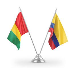 Colombia and Guinea table flags isolated on white 3D rendering