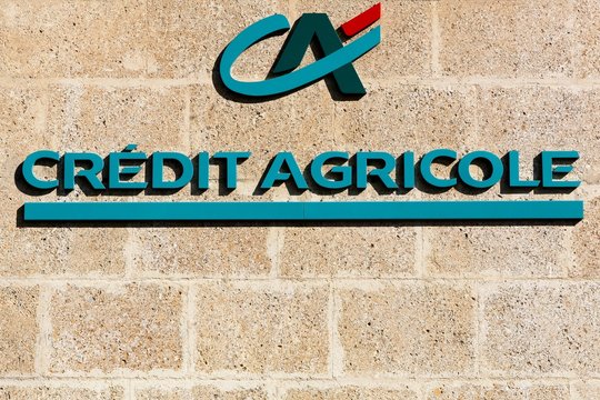 Valensole, France - July 9, 2016: Credit Agricole logo on a wall. Credit Agricole is a French network of cooperative and mutual banks comprising the 39 Credit Agricole Regional Banks