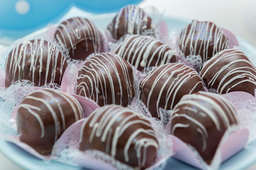 Close up of luxury pile of chocolate candies. Assorted chocolate candies.