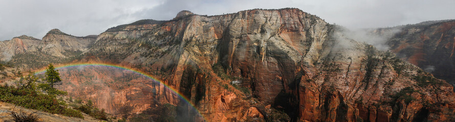 Rainbow in zion canyon with red rocks and gorgeous views