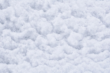 Fototapeta na wymiar Winter texture of white fluffy snow. White fresh snow background