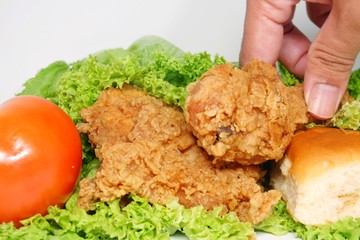 Fresh homemade fried  chicken with vegetables and hand insight 