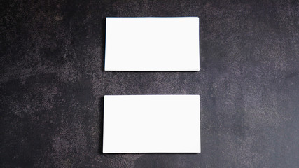 Mockup white business card on black background.