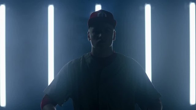 Caucasian professional baseball player batter posing against bright lights. 4K UHD 60 FPS SLOW MOTION shot on ARRI Alexa Mini with Cooke S4 lens