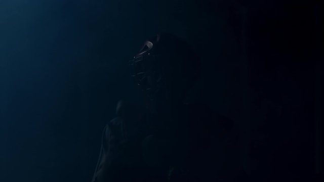 FIXED Caucasian professional baseball player catcher posing against bright lights. 4K UHD 60 FPS SLOW MOTION shot on ARRI Alexa Mini with Cooke S4 lens