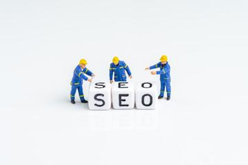 SEO, Search Engine Optimization, website search result advertising concept, miniature people...