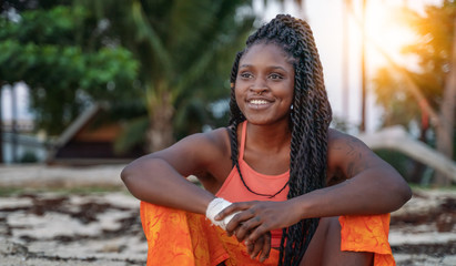 Charming beautiful young african american woman girl with black pigtails with piercings on her...