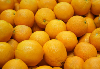 close up on fresh orange in pile