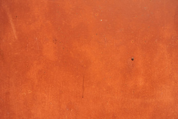 The iron wall was painted orange to look like rust.