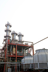 Fototapeta na wymiar Distillation equipment and oil storage tank