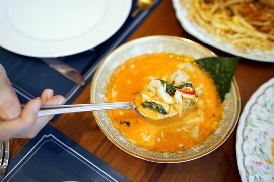 Red curry crab meat with chaplo - The bowl of crab curry with betel leaves served with rice vermicelli, Delicious hot and spicy, Traditional Thai food recipe, Most popular in Thailand.
