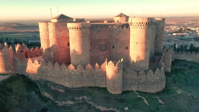Aerial panorama view of Belmonte castle in Cuenca province Spain with long stretching city walls topped with battlements