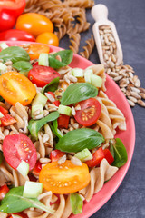 Salad with wholegrain pasta and vegetables as healthy meal containing vitamins and minerals