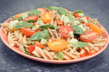 Salad with wholegrain pasta and vegetables as healthy meal containing vitamins and minerals