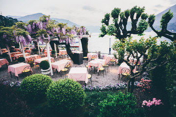 Outdoor Restaurant On Lake Como. Wisteria on a restaurant terrace.