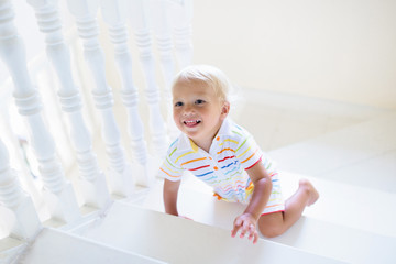 Kids on stairs. Child moving into new home.