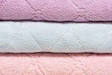 Stack of bath towels close up background.