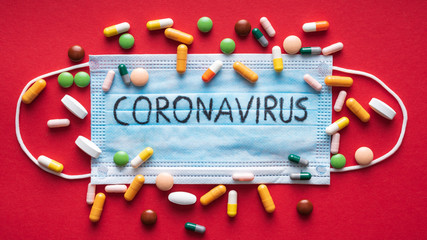 Coronavirus - 2019-nCoV, WUHAN virus concept. Surgical mask protective mask on red background with...