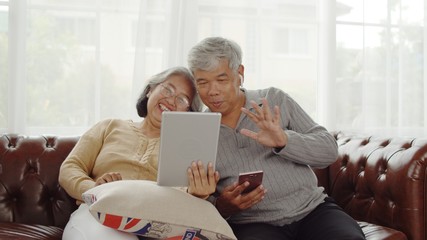 Senior couple making video call with happiness at home