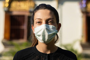 Young woman wearing medical face mask